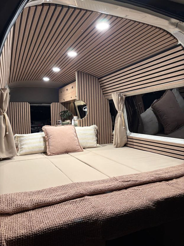 2018 Toyota Hiace Jumbo campervan slat-panelled interior with bed